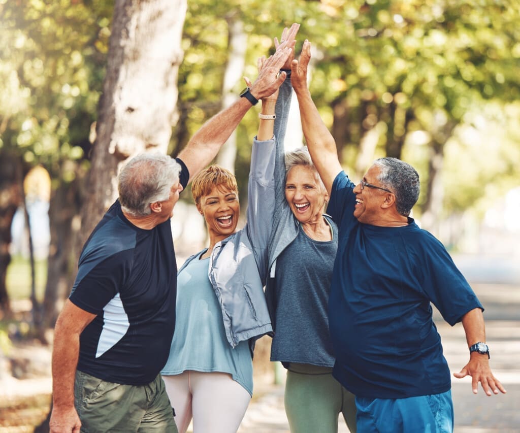 Happy, senior or people high five for fitness training goals, workout target or exercise achievement